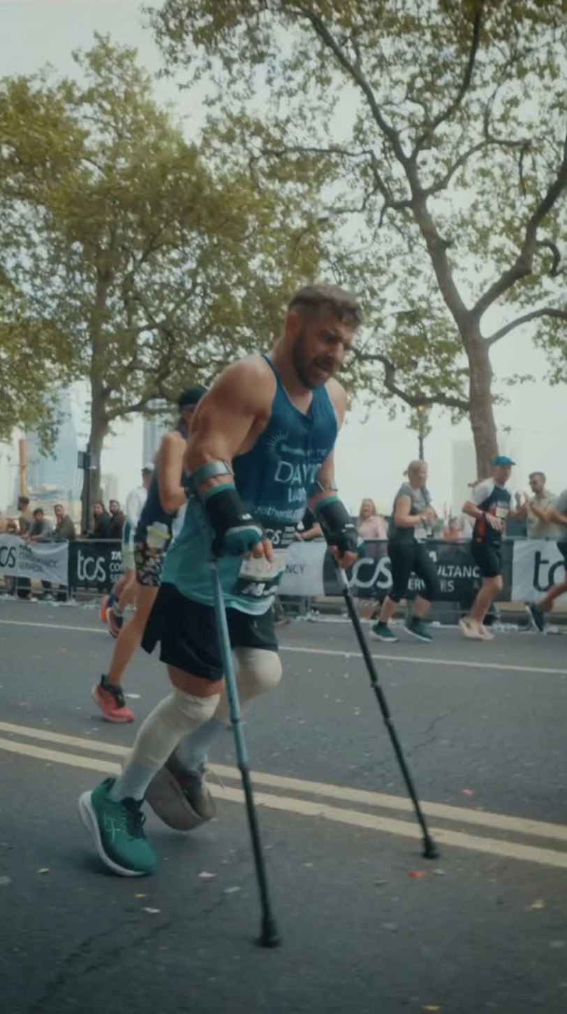 David racing the London Marathon on crutches